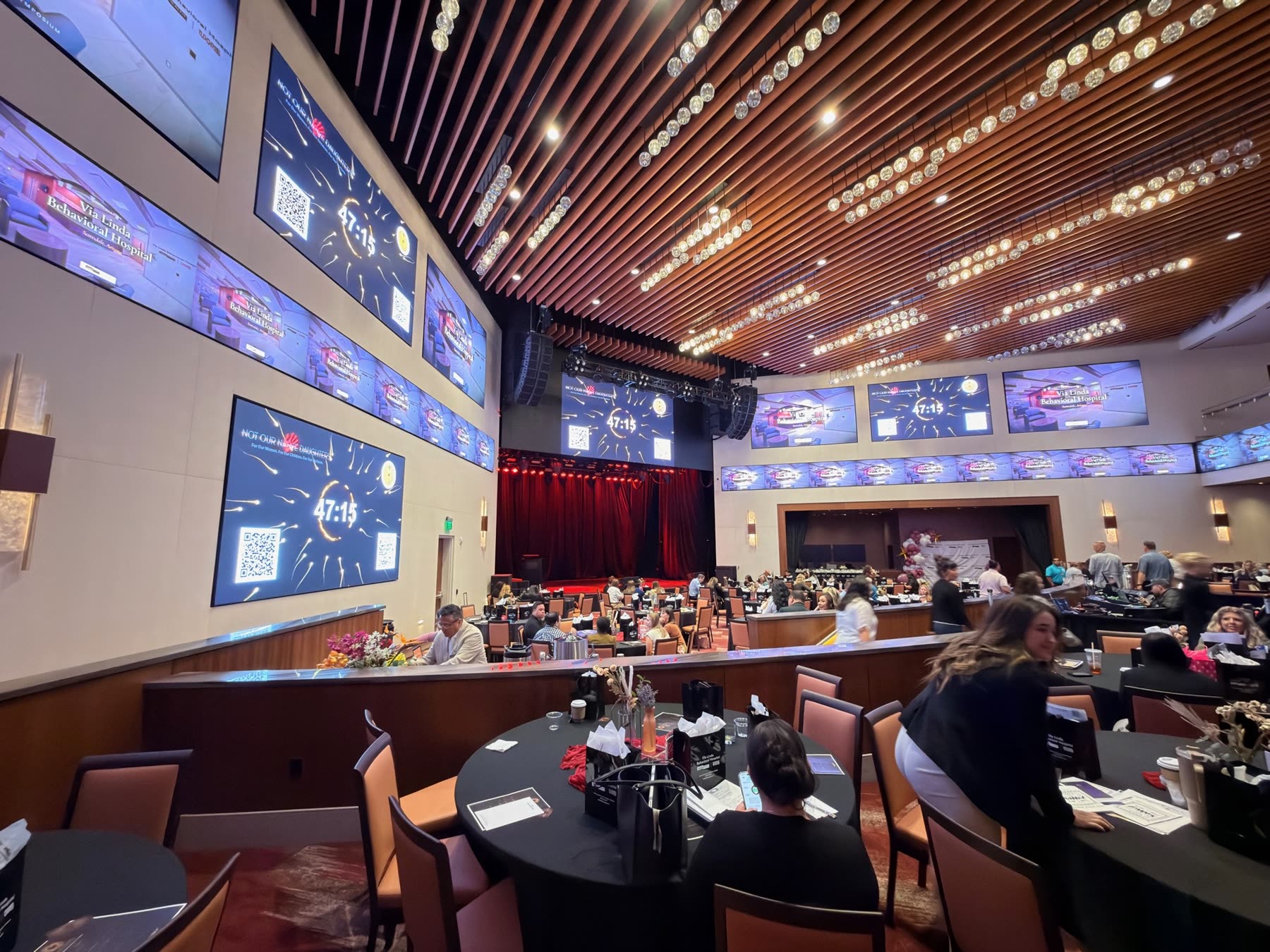 The same screens during the symposium, carrying the event countdown