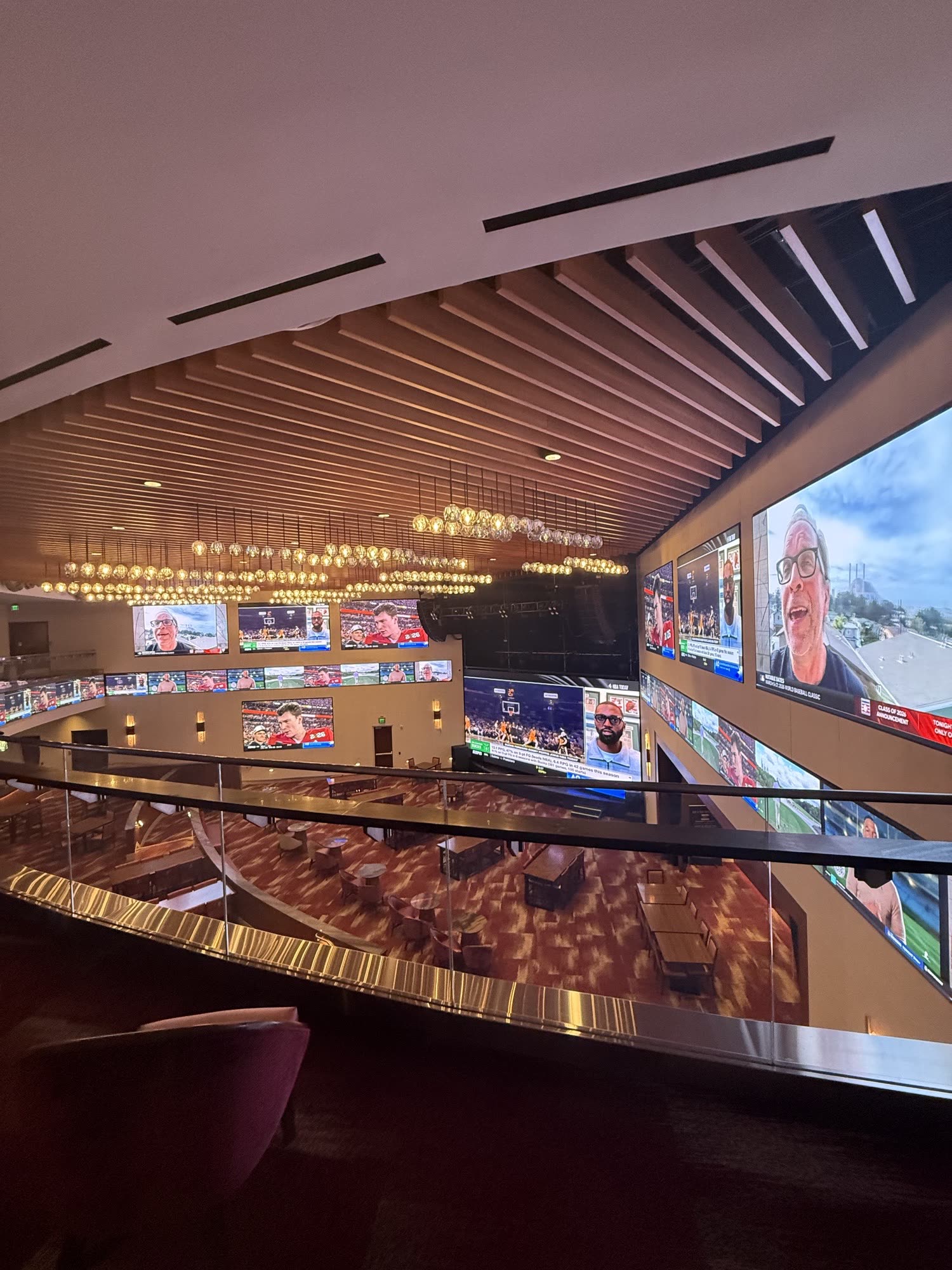 The showroom on the scouting visit, screens running the venue's default feed