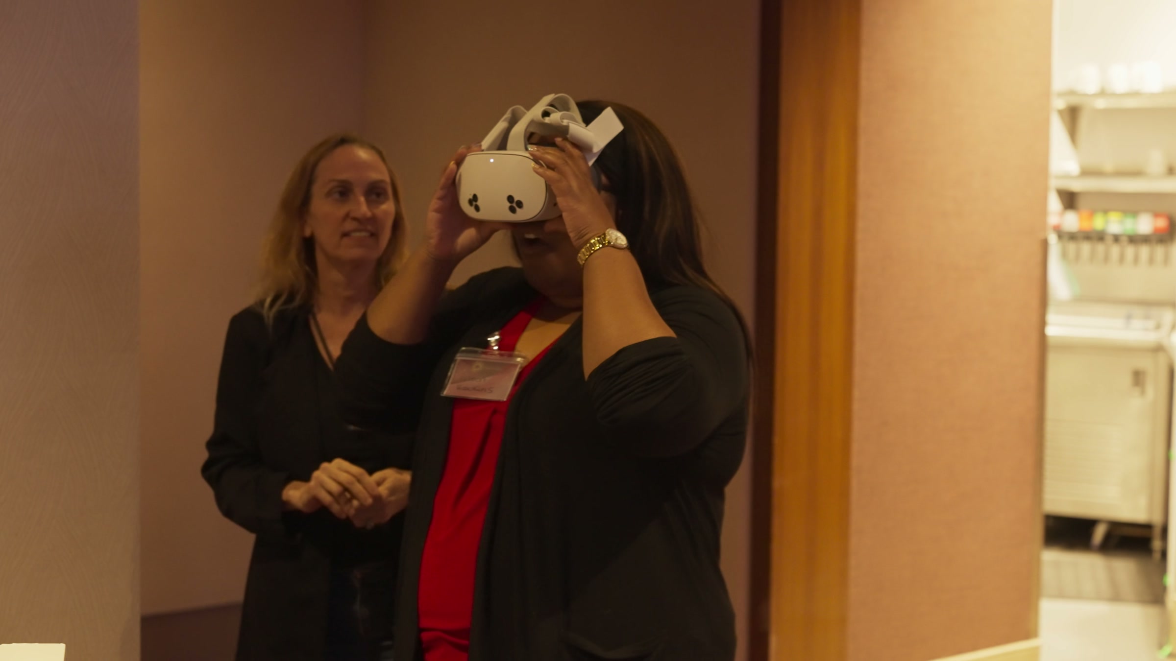 Attendees trying headsets at the demo booth during lunch